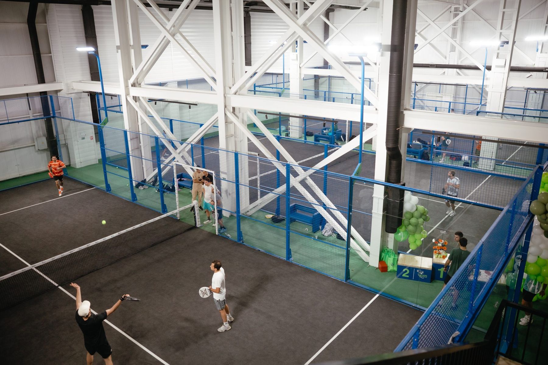 Players on the indoor courts at PADEL BATTLE