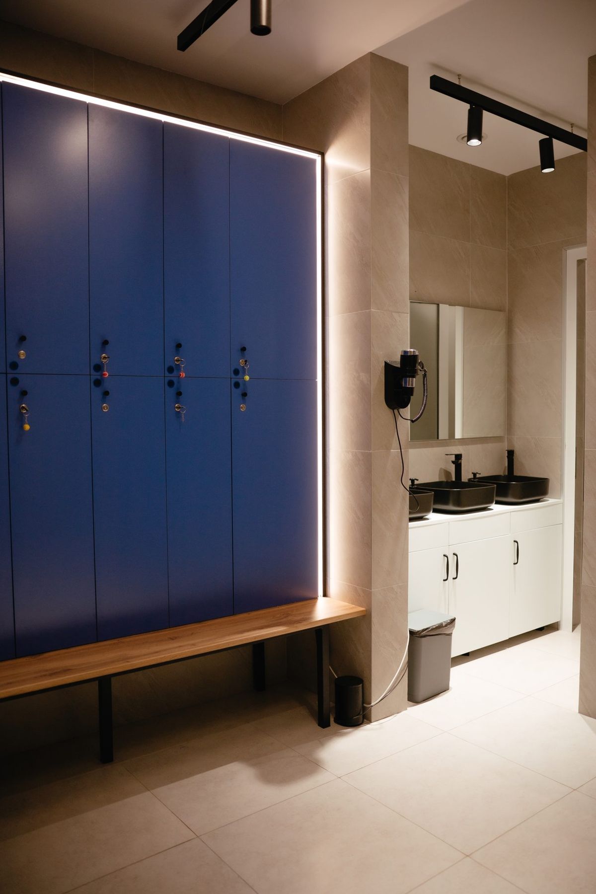 Blue lockers and benches in the changing room