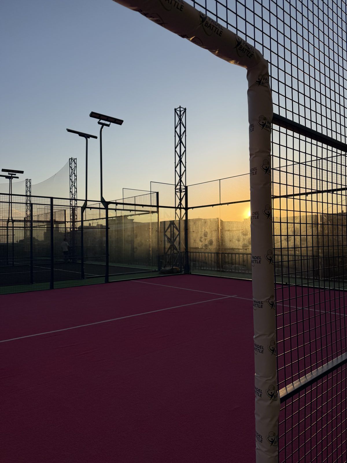 Sunset over the pink rooftop court